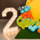 The kids will get hooked on the cake table decorated with the money plant bells.