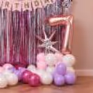 Free-Floating Balloons And Gold Digit Foil Balloons Fill The Party Room With Birthday Energy.