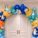 Organic Balloon Arch Design With Bluey Character Cutouts In Pastel Blue, Yellow And Orange Balloon Style.