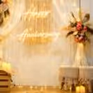 Decorative elements such as wooden crates, candles and woven ottoman stools.