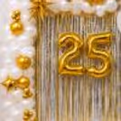 Curtain backdrop with silver or gold fringe to organise a gorgeous anniversary photo wall.