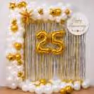 Gold 25 balloons with a shiny silver fringe curtain to celebrate a 25th anniversary.