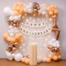 Peach, white and champagne balloon arch for an elegant party style.