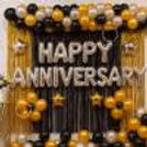 Gold star balloons were next to a garland of balloons for the anniversary celebration.