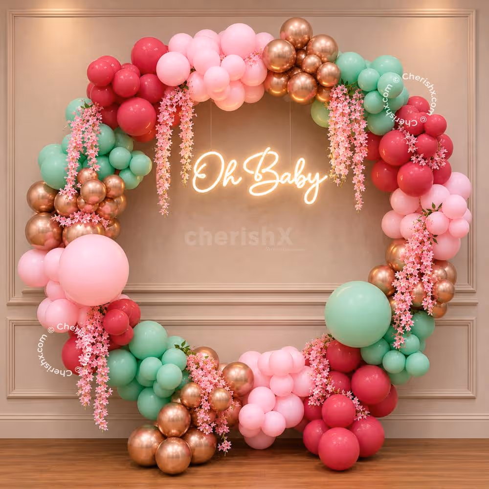 Cascading pink and pastel tones create a dreamy baby shower backdrop