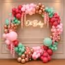 Cascading pink and pastel tones create a dreamy baby shower backdrop