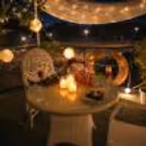 Make your evening unforgettable with CherishX’s open-air candlelight dining experience near a horse stable.