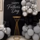 A Gold Display Stand Was Placed At The Centre With Balloon Arrangements On Both Sides.