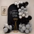 Decorative Arrangement With Chrome Accents And A Curved Panel For Father’s Day.