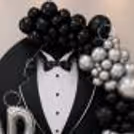 Beautiful Father’s Day photo setup with bow tie detailing on a tuxedo backdrop.