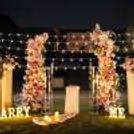 A photo frame pathway with candles creates a magical entrance.