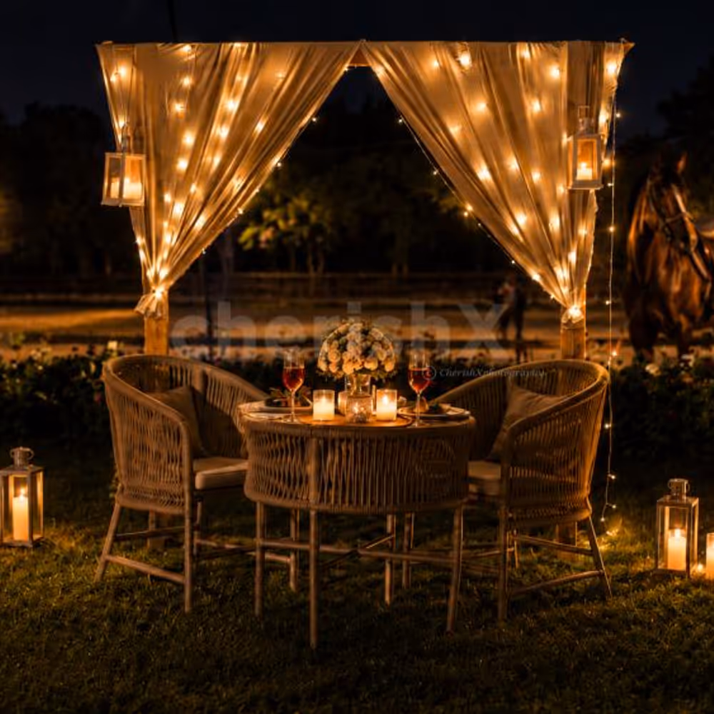 Enjoy a romantic candlelight dinner by CherishX, set in a dreamy open-air horse stable with fairy lights, flowers, and a luxury private dining setup