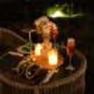 A dreamy outdoor candlelight dinner by CherishX, designed with glowing candles, elegant flowers, cozy seating, and a magical horse stable backdrop