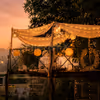A dreamy CherishX candlelight dinner on a beautiful machan, surrounded by fairy lights, horses, and open-air romance