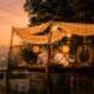 A dreamy CherishX candlelight dinner on a beautiful machan, surrounded by fairy lights, horses, and open-air romance