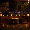 Romantic rooftop candlelight dinner with stunning city views and elegant ambiance.