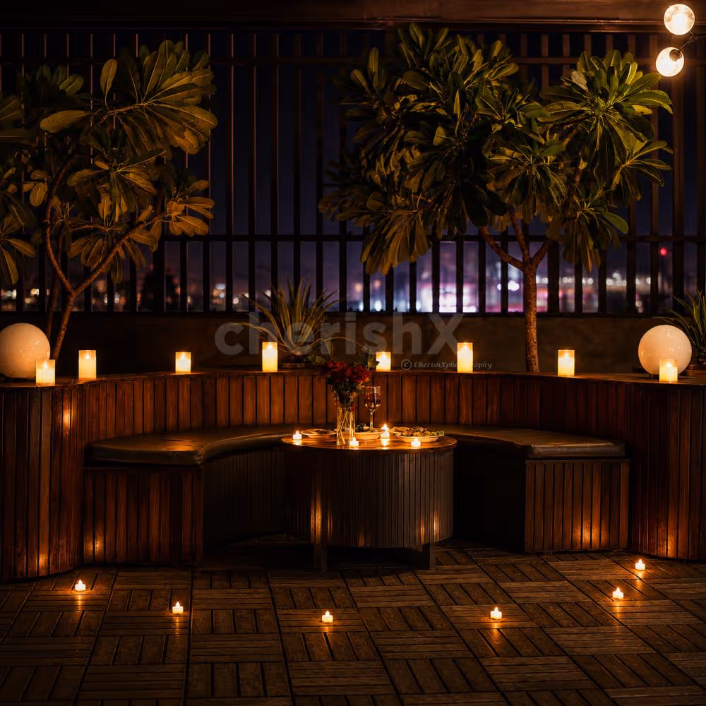Romantic rooftop candlelight dinner with stunning city views and elegant ambiance.