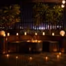 Private, terrace candlelight dinner with a romantic dining table and comfier bench seating.