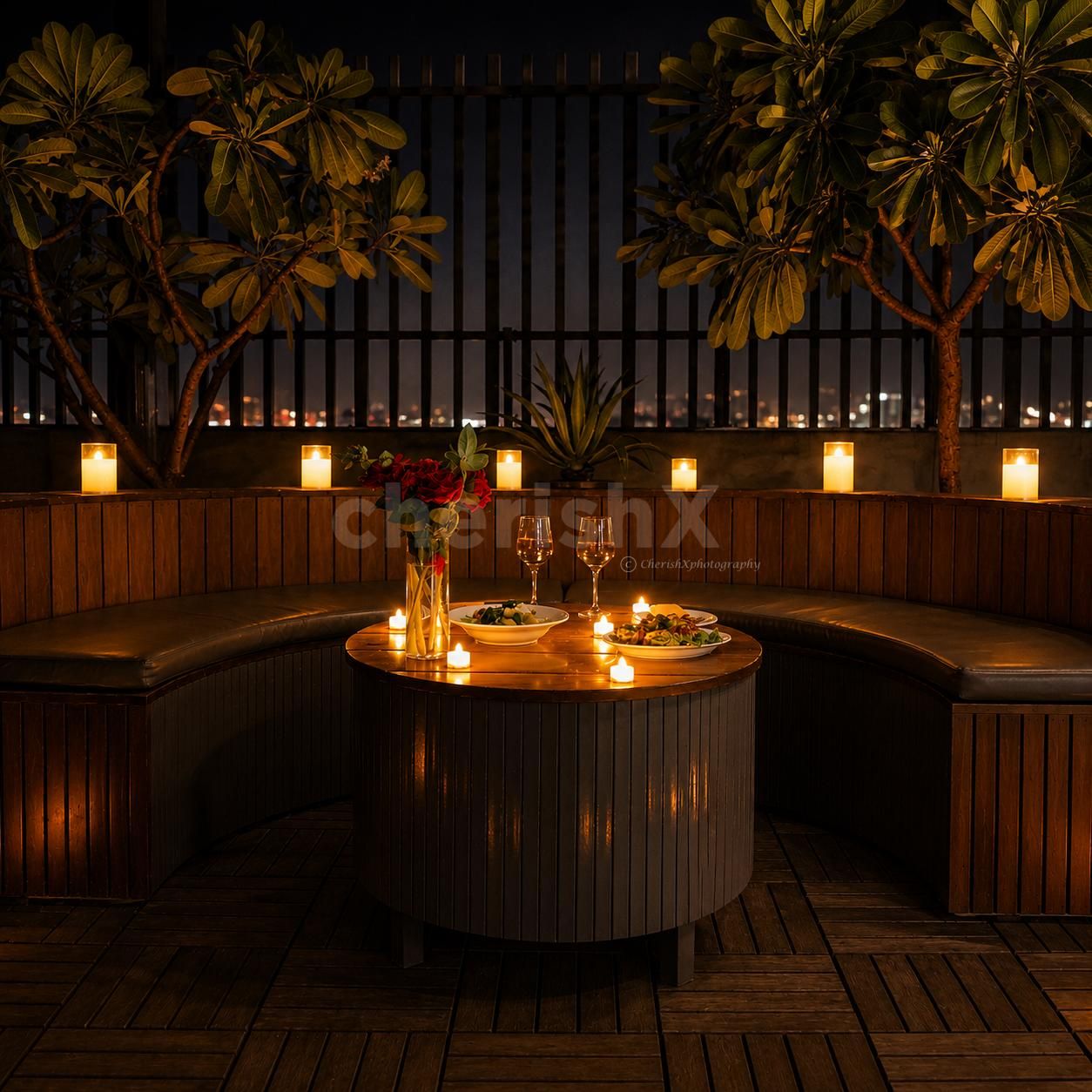 Romantic rooftop candlelight dinner with stunning city views and elegant ambiance.