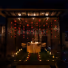 A Fairytale Gazebo Structure Creates A Romantic Scene Outdoors With Delicious Dinner.