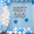 Metallic Best Dad Letter Balloons In Backlighting And Shimmering Curtain Decoration Theme.