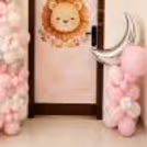 Soft Organic Balloon Arrangement With Moon And Star Foils. It Creates A Good Newborn Welcome Design.