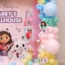Colourful Gabby’s Dollhouse Birthday Photo Booth Decor with Cartoon Characters & Pastel Balloon Setup.