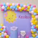 Round-themed cake table creates visual appeal.