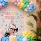 Birthday Decoration For Hello Kitty With Custom Banner, Character Artwork And Clusters Of Pastel Balloons.