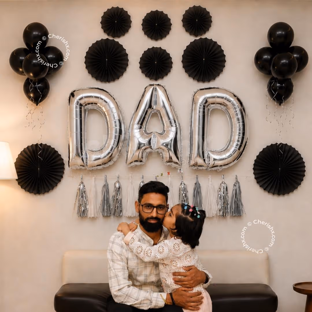 The Centre Is A Black Design With Large Silver Letter Balloons Spelling Dad