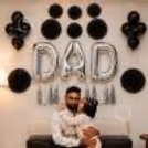 Father's Day Wall Decoration Using Silver DAD Foil Balloons And Black Paper Fan Decor.