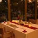 Intimate dining setup for couples featuring candlelit ambiance and elegant table styling