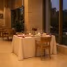 Elegant couple dining experience with romantic table decoration and panoramic garden views