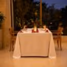 Luxury indoor date night setup featuring candlelit table décor and premium dining ambiance
