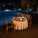 Luxury Rooftop Poolside Dining Experience with Romantic Decor and Fine Dining