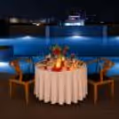 Elegant Couple Dining Experience with Pool Views and Candlelit Ambience