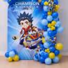 Colourful Party Decor, Large Beyblade Character Display With Balloons Around.