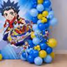 Kids Party Decoration With Colourful Balloons, Themed Cutouts And Beyblade Graphics.