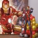 Superhero Standee Placed In Front Of A Birthday Display.