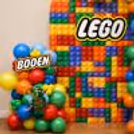 Name Board Placed In Front Of A Lego-Style Birthday Background.