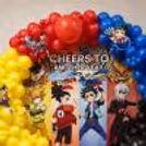 Anime Party Background With Character Standees And Balloon Decoration.