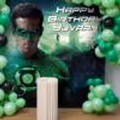 Personalised Banner For Indoor Party Decoration. Also, A Layered Balloon Arrangement In Green Shades.