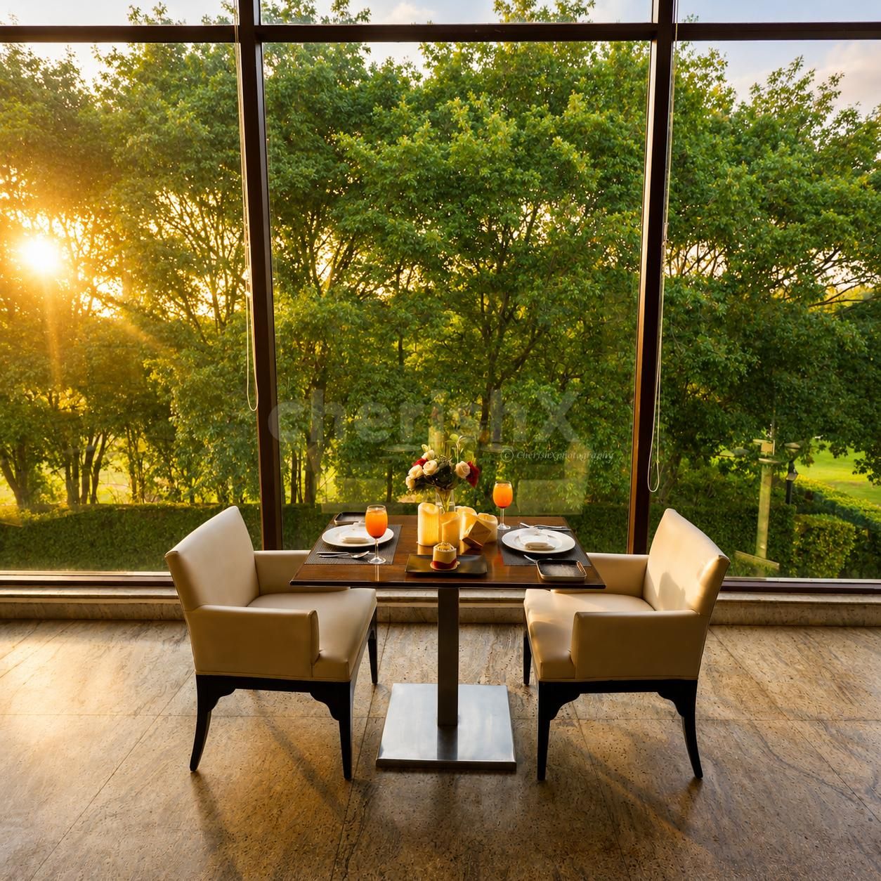 Romantic dining experience at Four Points by Sheraton featuring candlelit table décor, floral arrangements, gourmet dining, and luxury ambiance.