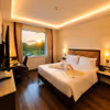 Romantic staycation room with decorative towel art, cozy interiors, and a comfortable king-size bed for a memorable stay.