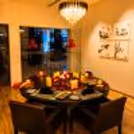 Round table with a meal served on an elegant table setting.