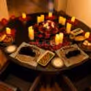 Beautiful table setting with elegant dinnerware, candles and dessert.