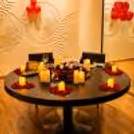 Close up of gourmet food supplies, cutlery, serving dishes, drinks and decorative touches.