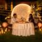 Moonlit Proposal Dinner Setup with Moon Backdrop, Candlelight Table and Lawn Decor