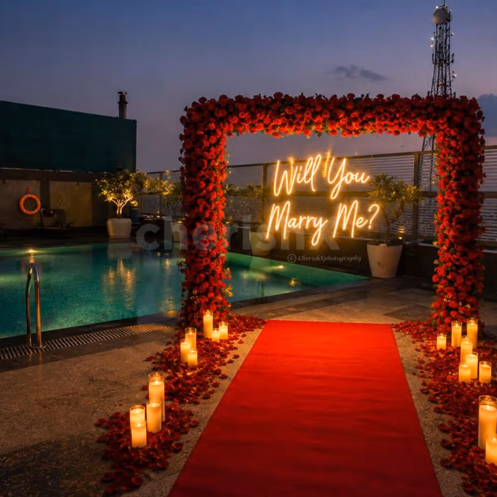 Romantic proposal setup at rooftop poolside in gurgaon