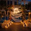 Will You Marry Me Neon Sign and Romantic Candle Decor, Dreamy Poolside Proposal Setup at Sarovar with Floral wall.